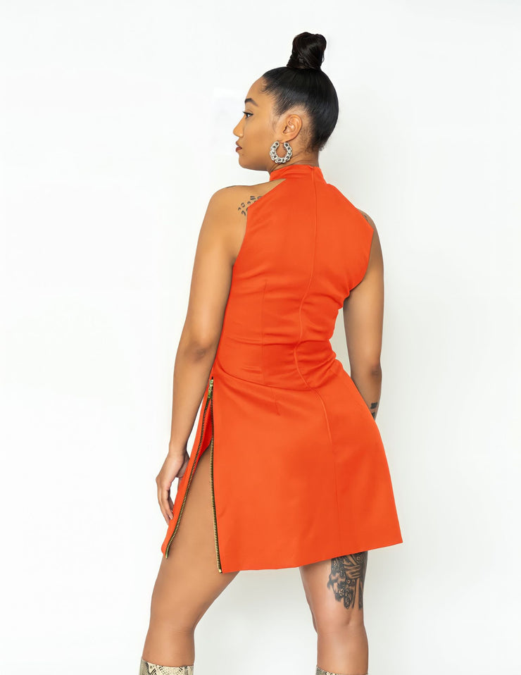 Model wearing jeju dress in sunkist orange on white background